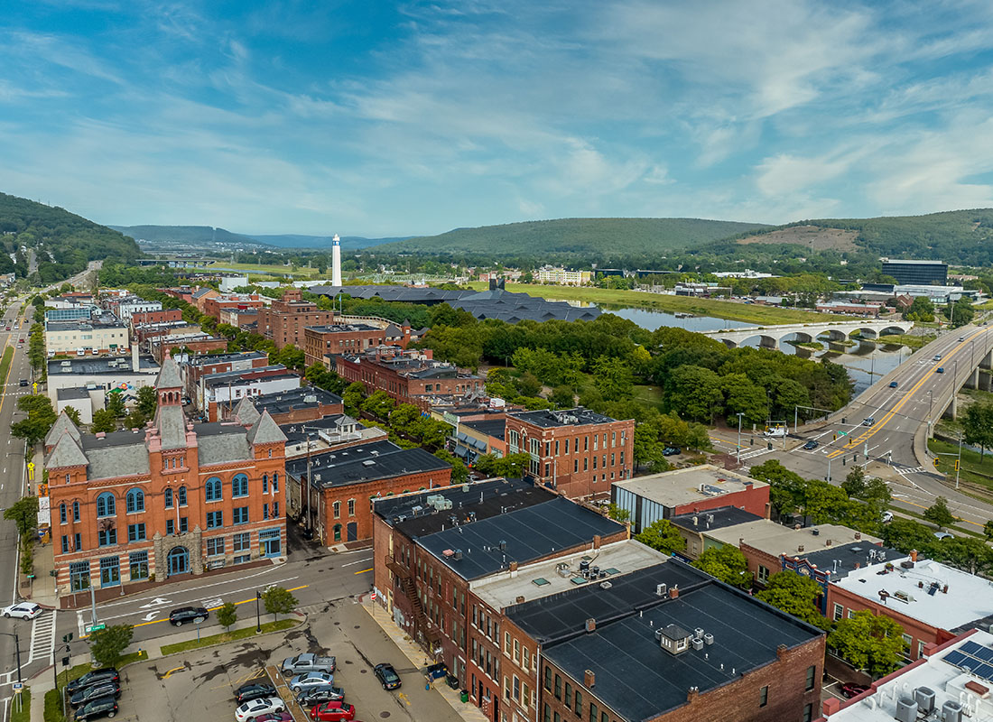 Horseheads, NY - Aerial View of Horseheads, NY Area With Buildings and Trees on a Sunny Day